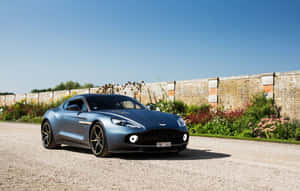 Εκπληκτικό Aston Martin Vanquish σε κίνηση σε γραφικό δρόμο — Steam Deck Ταπετσαρία